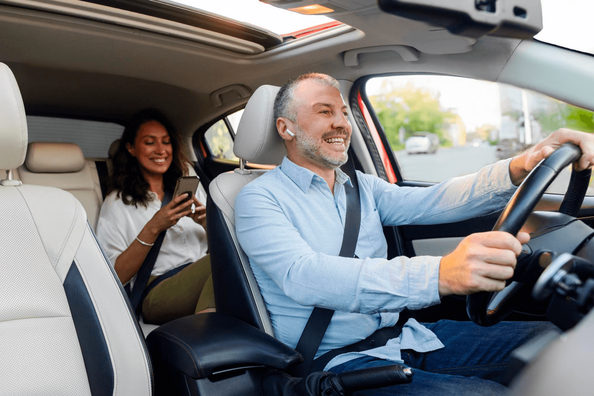 Smiling VGM Fleet driver with a passenger